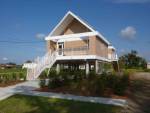 Shigeru Ban. Documentation of Post-Katrina Housing (Make it Right), New Orleans, 2009. Photograph and exterior view, 23.4 x 16.5 in. Courtesy Aspen Art Museum, Aspen.